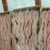 Premium frozen JTB fish with characteristic pink-silver scales and yellow stripes, flash-frozen for high-quality frozen seafood retail.