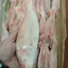 Premium frozen JTB fish with characteristic pink-silver scales and yellow stripes, flash-frozen for high-quality frozen seafood retail.