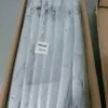 Premium ribbon fish with a distinct silver sheen layered in a bulk shipping box for the frozen seafood market.
