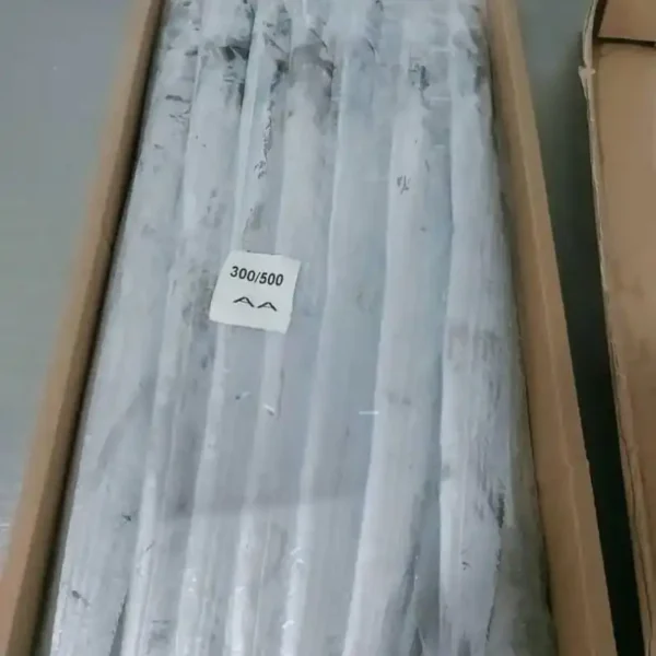 Premium ribbon fish with a distinct silver sheen layered in a bulk shipping box for the frozen seafood market.